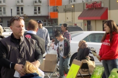David massages a San Diego homeless lady's head.