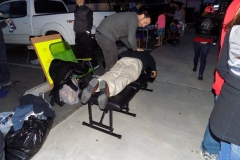 Dr. Eric adjusts a homeless persons back.