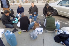 The homeless feet washing team is hard at work washing feet!