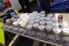 The Lids of Encouragement table with all the lids and encouraging words for San Diego's homeless.