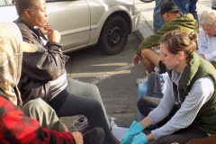 Anne washes a homeless women's feet on Easter