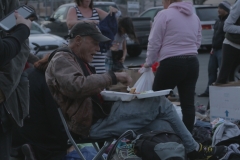 A downtown San Diego homeless man eats at our Streets of Hope event on Easter.