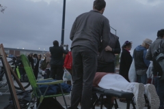 Massaging the homeless even as they line up for food downtown on Easter.