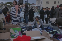 A homeless women sifts through the clothing donations on Easter.
