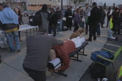 Professional masseuse David, massages homeless man Mark's back.