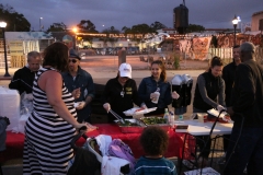 A homeless women and her baby, and son are served food this Easter.