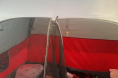 A homeless tent on the streets of downtown San Diego, notice the cross hanging.