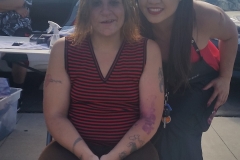 Tammy and a homeless woman are all smiles after a great hair cut.