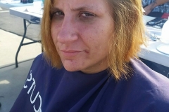 A homeless woman AFTER the Streets of Hope cut his hair.