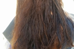 BEFORE: A homeless woman before she has her hair cut downtown.