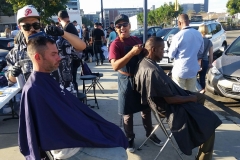 Mario and Wylie cut the homeless' hair downtown.