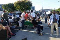 Making food to feed the homeless downtown while cutting hair.