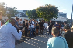 The Streets of Hope San Diego circle up before passing out food in downtown San Diego.