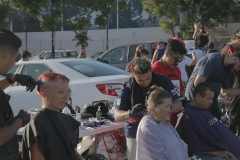 The Country Club Barber Shop stylists cut the homeless hair downtown.