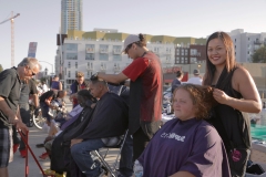 Tammy cuts Deborah's hair in downtown San Diego.