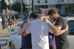 Dan, Ryan and Jason pray for a homeless woman in pain and scared.
