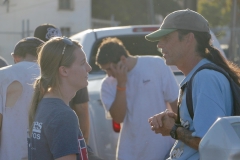 Kaitlin talks to a homeless man about his needs.
