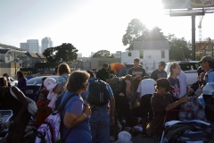 Passing out clothing donations to the homeless.