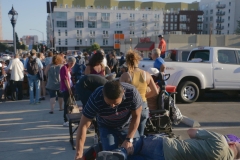 Jeremy gives a chiropractic adjustment to a homeless man.