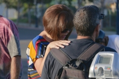 Emma prays for a homeless man.