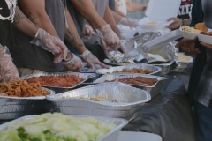 Clean food handling techniques while feeding the homeless downtown.