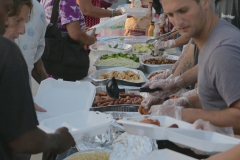 Carefully meeting the homeless requests for food downtown.