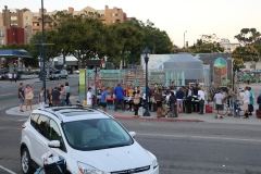 Lining up for food to feed the homeless in downtown San Diego.