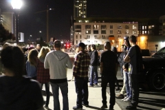 Circling up at the end of the night to tell stories about feeding the homeless on Halloween.