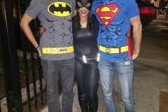 Charlie and Joe with a Cat Women in the middle feeding the homeless on Halloween
