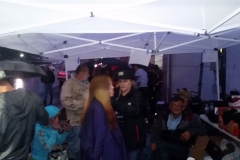 Under the canopies as the homeless line up in the rain at our Thanksgiving event.