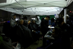 Cutting San Diego's downtown homeless hair in the dark and rain for our Thanksgiving event.