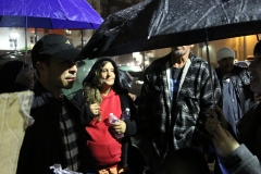Carlos helps the homeless on Thanksgiving downtown in the rain.