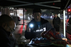 Parker helps size up shoes for the homeless in downtown San Diego.