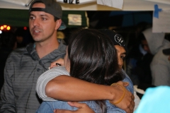 Homeless hair stylists Wylie and Tammy hug after cutting the hair for over 30 homeless people.