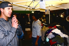 Homeless volunteer David on the mic before passing out clothing donations to the homeless on Thanksgiving.