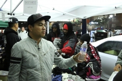 Passing out water to the homeless on Thanksgiving.