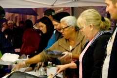 Streets of Hope volunteers serve up a Thanksgiving meal to the homeless.