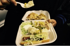 A great homeless Thanksgiving meal with Turkey, salad, corn, mashed potatoes, and even a hot dog!