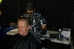 Mario from the Country Club Barber Shop cuts a homeless man's hair at our Christmas event!