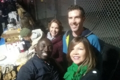 Posing for photos with the homeless at our Christmas day event.