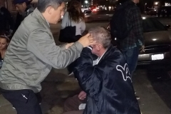 Leland, Streets of Hope San Diego Chiropractor adjust a homeless man back.