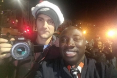 Nate and Conrad documenting the Streets of Hope Christmas event.