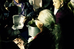Our master chef Christina dishes out the amazing hot ham dinner she made at home for 150 homeless.