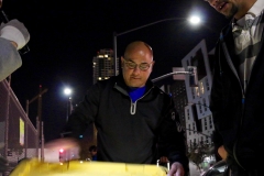 Paul looks for the right size shoe for a homeless man.