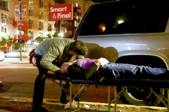 Leland, our Streets of Hope San Diego chiropracter, gives a homeless woman an adjustment.