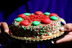 Our homeless friend David holds his birthday cake we gave him at our Christmas event.
