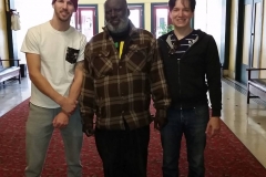 Joe, Milton and Dan stand in the lobby of the Golden West Hotel downtown San Diego.