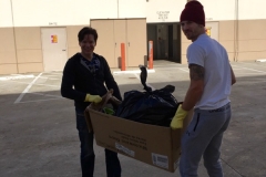 Dan and Joe taking out trash from Milton's storage unit.