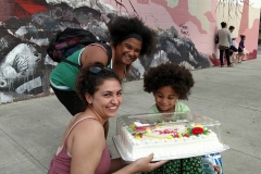 LaQuitas, Victoria and little Lauren check out the cake Paul and Victoria presented her.