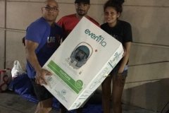San Diego Streets of Hope volunteer gives Justin and Maria a baby car seat to get newborn Michael out of the hospital.